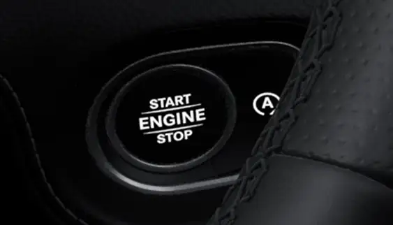 Start Engine Stop push-button beside the steering wheel rim