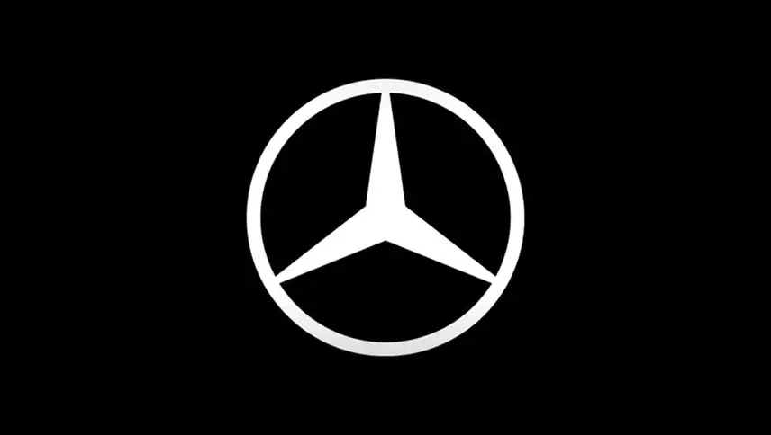 White Mercedes-Benz star emblem on a black background