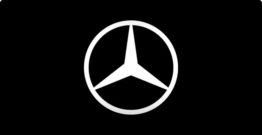 White Mercedes-Benz star emblem on a black background