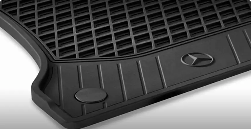 Black rubber all-season floor mat with deep channels and a Mercedes-Benz star