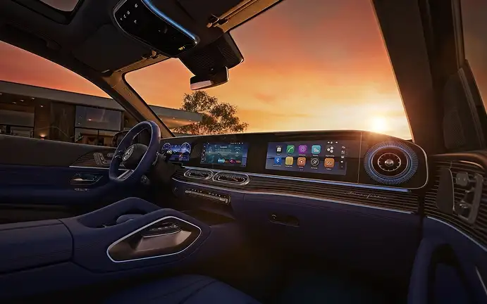 GLE dashboard and MBUX Superscreen with blue ambient lighting at sunset