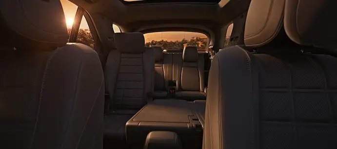 GLE rear seats and cargo area lit by the setting sun