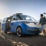 Family at the beach with their Volkswagen ID Buzz