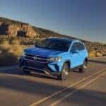 Blue 2026 Volkswagen Taos driving