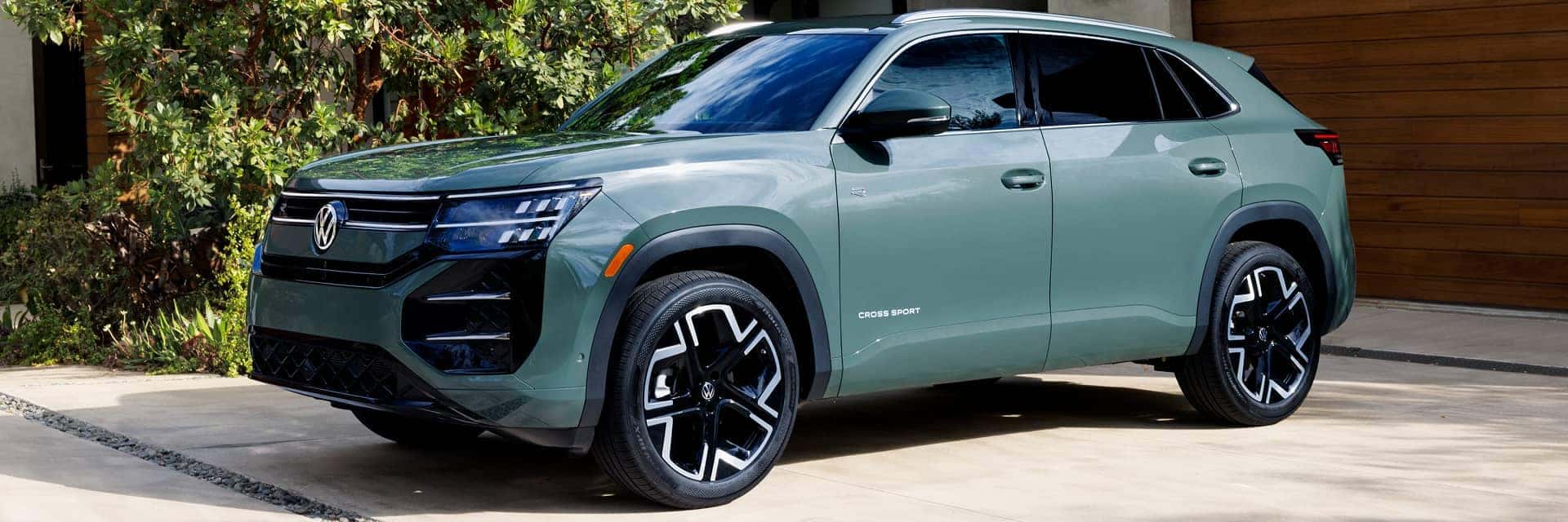 2027 Volkswagen Atlas Cross Sport parked in front of home