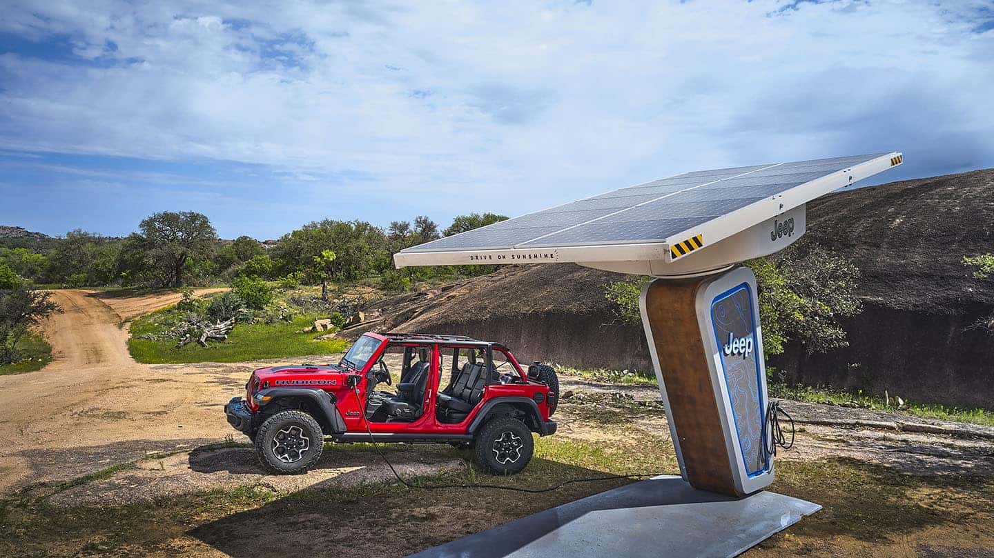 Picture of Electric Jeep Wrangler in the desert charging battery