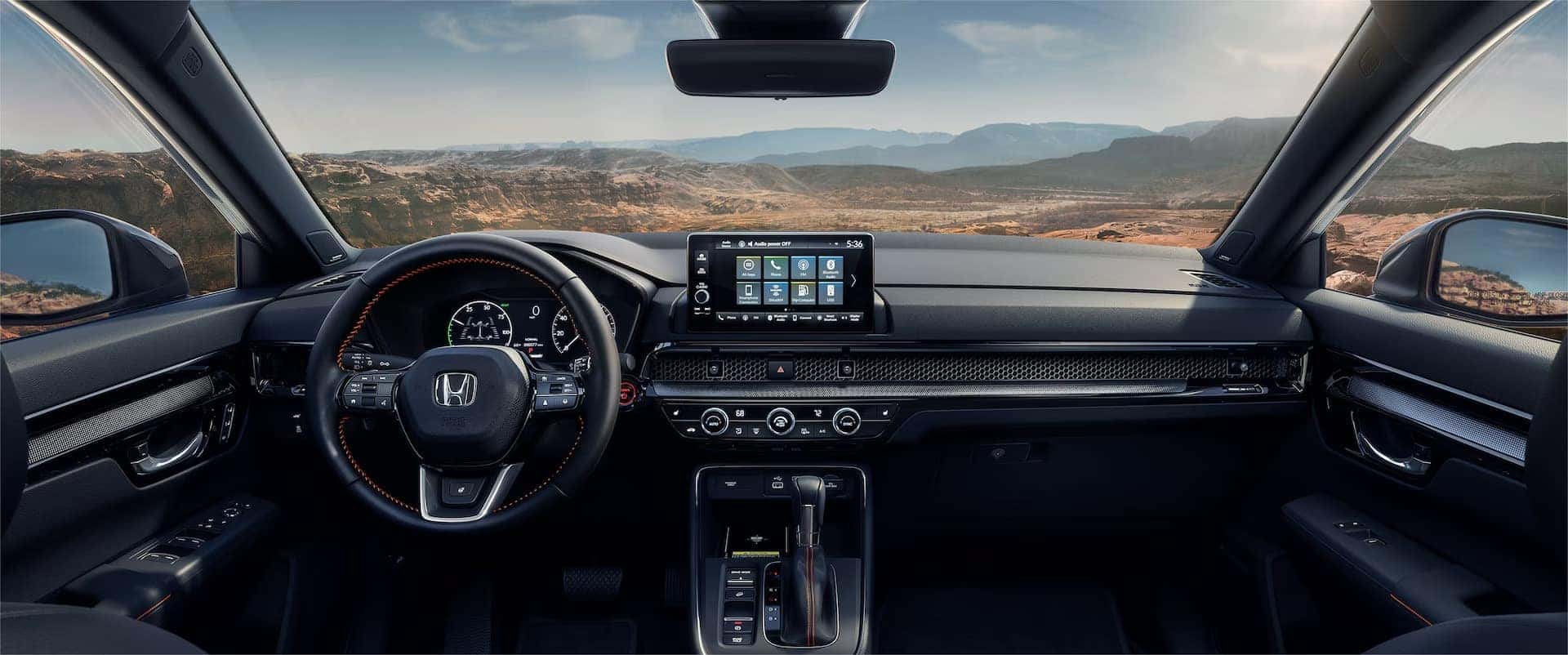 2025 Honda CR-V Hybrid interior showcasing its infotainment touchscreen.