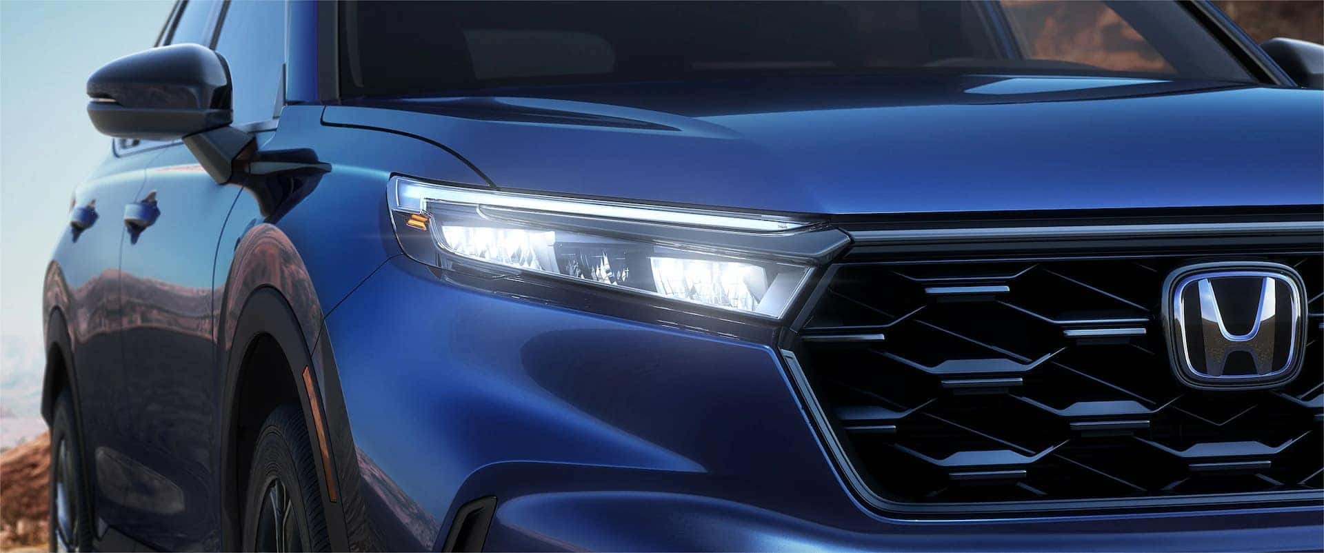 2025 Honda CR-V Hybrid's sleek front profile with LED headlights.