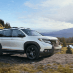 2020 Passport towing a trailer on a dirt road