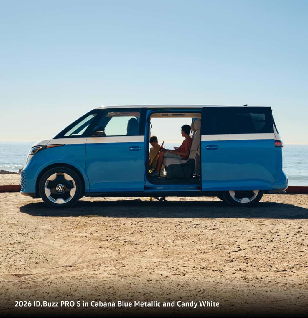2026 ID.Buzz PRO S in Cabana Blue Metallic and Candy White parked on beach with door open