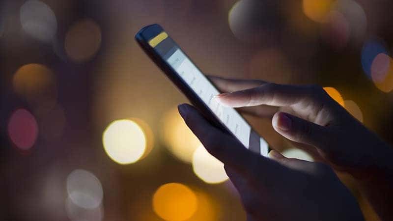 Woman holding cell phone