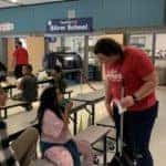KG employee talking to a child