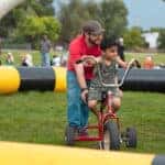 Boy riding a tricycle
