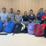 Back to School Bashes & Backpack Donation in Hawaii. Staff prepping backpacks