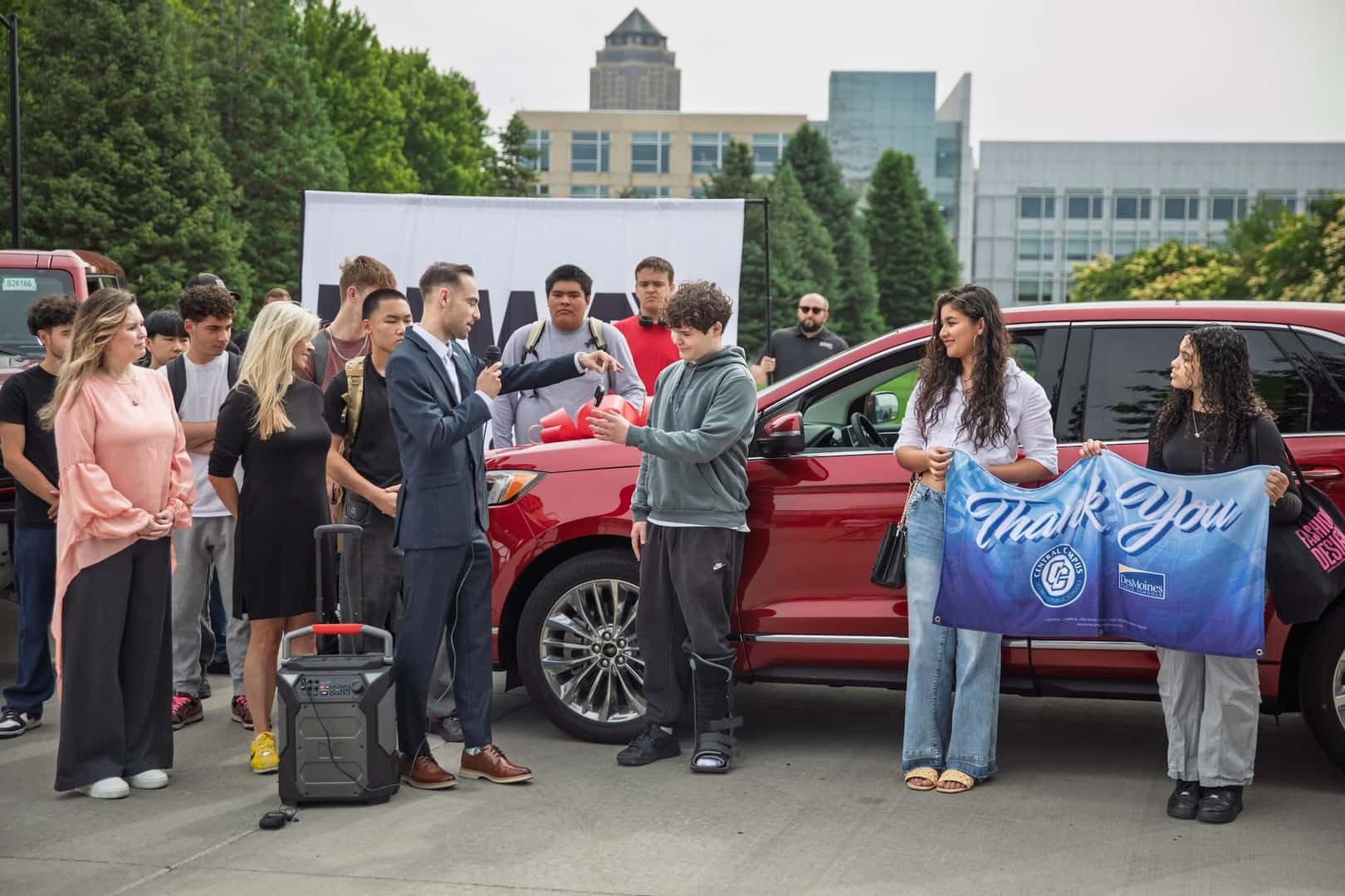 Des Moines students receive donated car for hands-on mechanic training