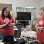 Employees packing hygiene kits