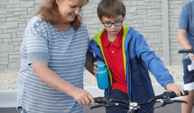 A cool new ride: Ken Garff delivers free bikes to kids in foster care