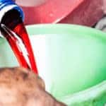 Pouring Transmission Fluid Into Funnel
