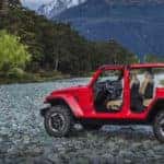 Jeep Wrangler without doors parked in mountain basin