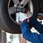 Mechanic Rotating Tires Using Impact Wrench 72032421