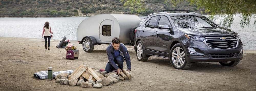 Gray Chevrolet Equinox Parked By A River to Camp