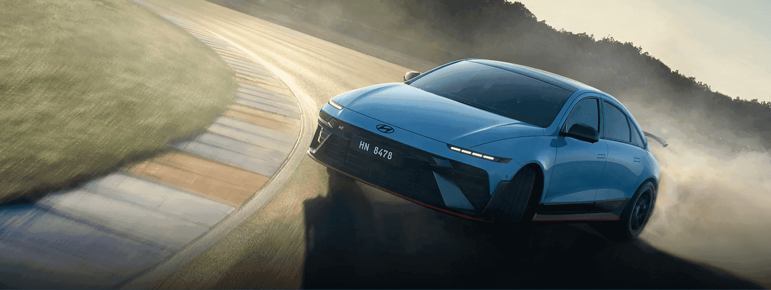 Hyundai vehicle driving on scenic road