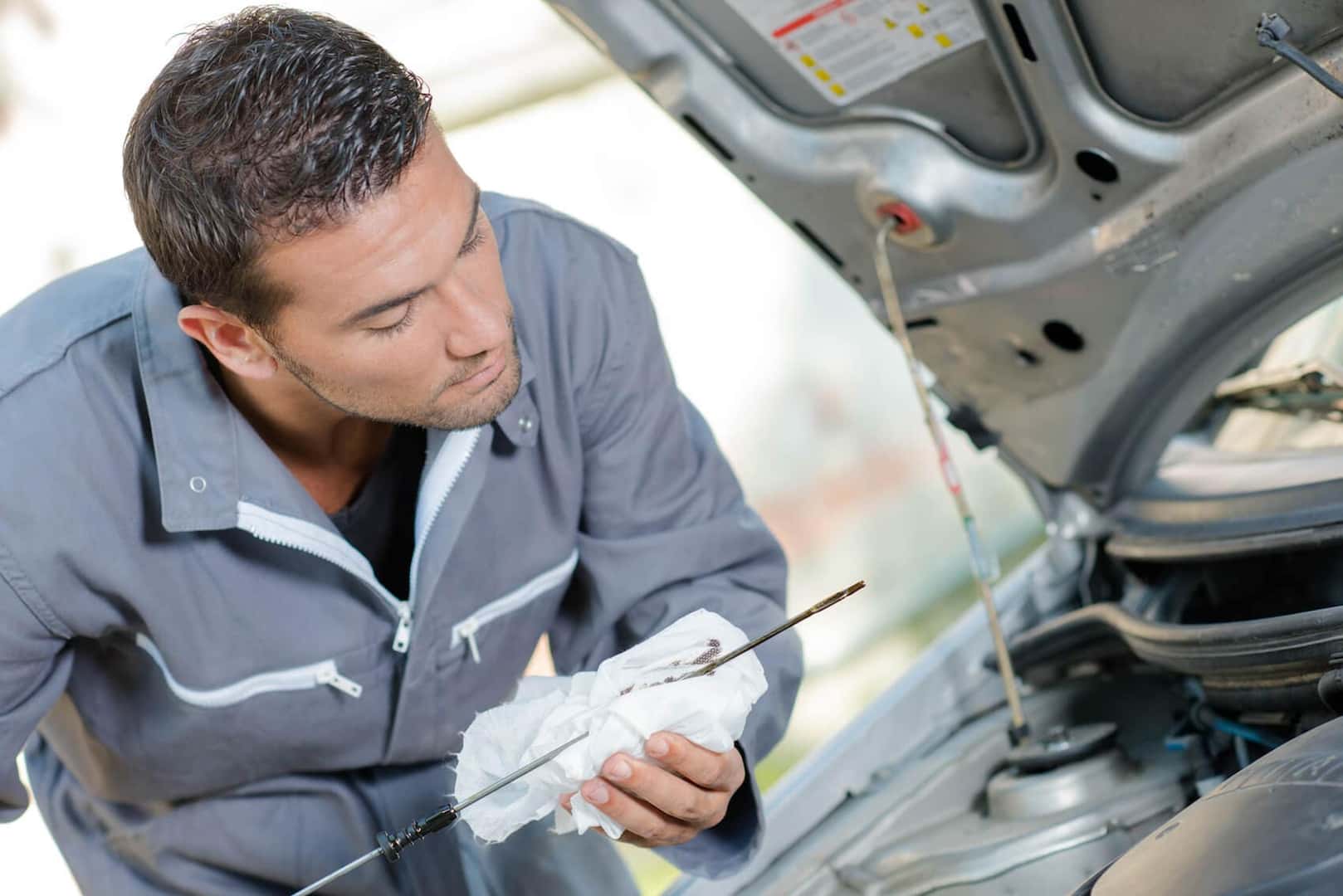 Mechanic checking oil Castle Rock, CO