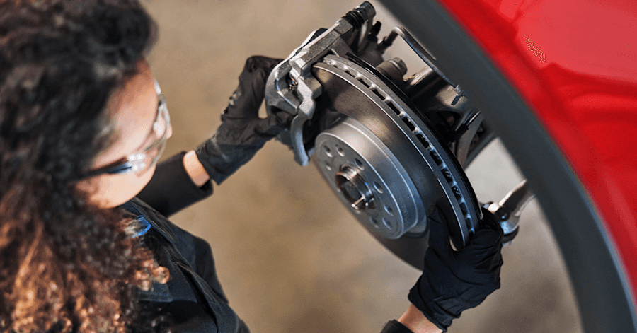 Volkswagen Master Technician conducting precision brake pad and rotor service in Columbia SC