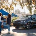 Black 2020 Chrysler Pacifica in parking lot tailgate