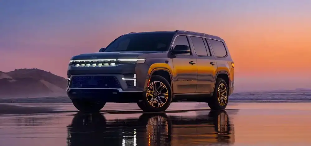 2026 Grand Wagoneer exterior with illuminated grille and full-width LED taillights