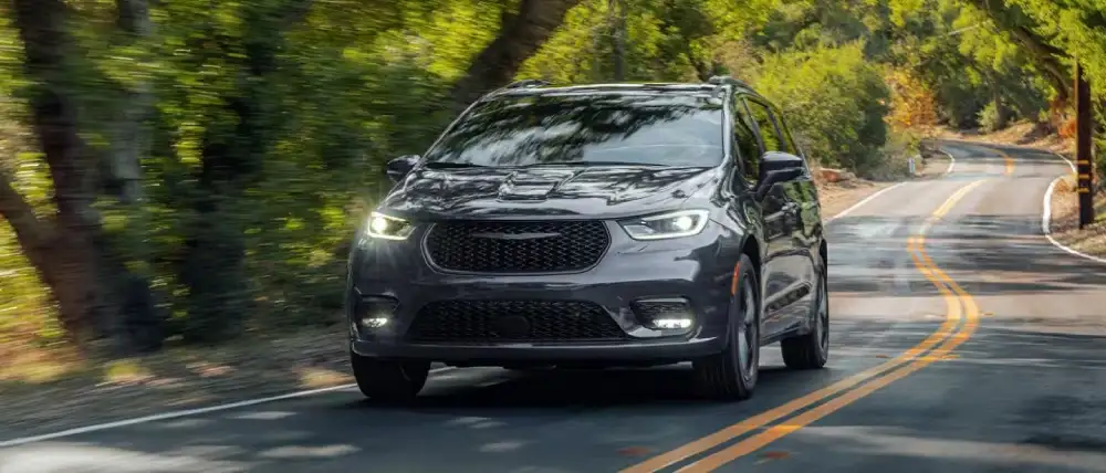 2027 Chrysler Pacifica exterior with redesigned LED headlamps and illuminated grille