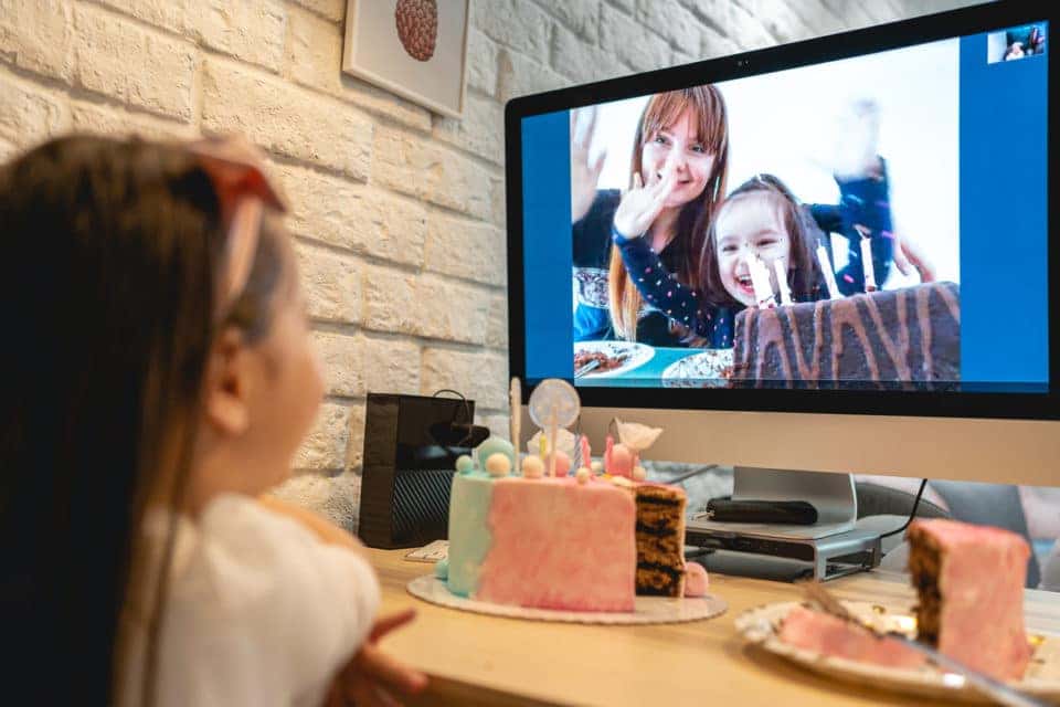 Preschool age girl celebrating her birthday at home because of social distancing.