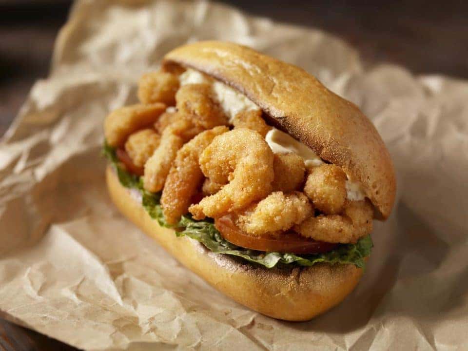 Shrimp Po Boy Sandwich on a Toasted Crusty French Roll with Lettuce, Tomato and Mayo