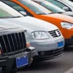 Cars parked in a row outside.