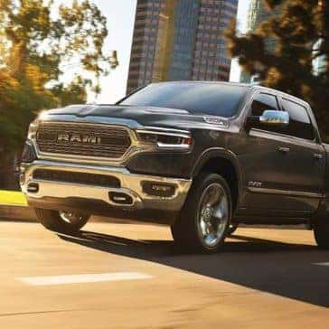 2019 Ram 1500 drives down city street