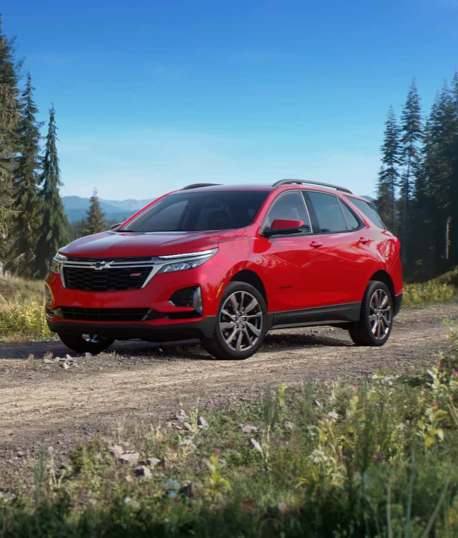 Red 2024 Chevy Equinox parked in the mountains