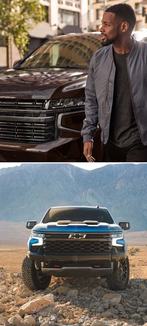 Man standing next to a Chevy Tahoe and a blue Chevy Silverado 1500 ZR2