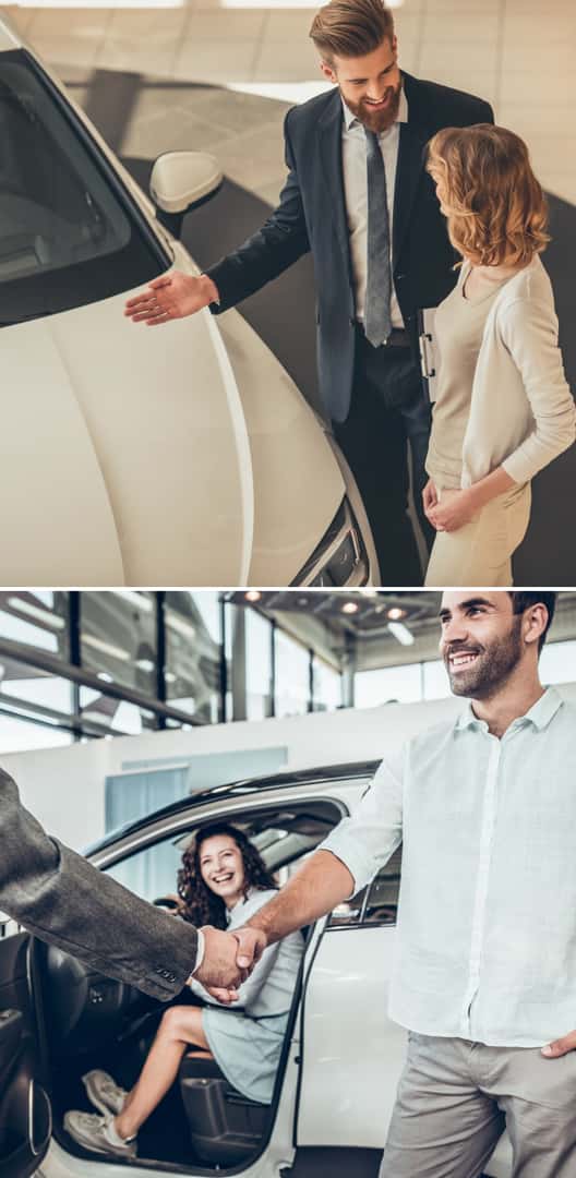 Salesman speaking to customers inside of a car dealership