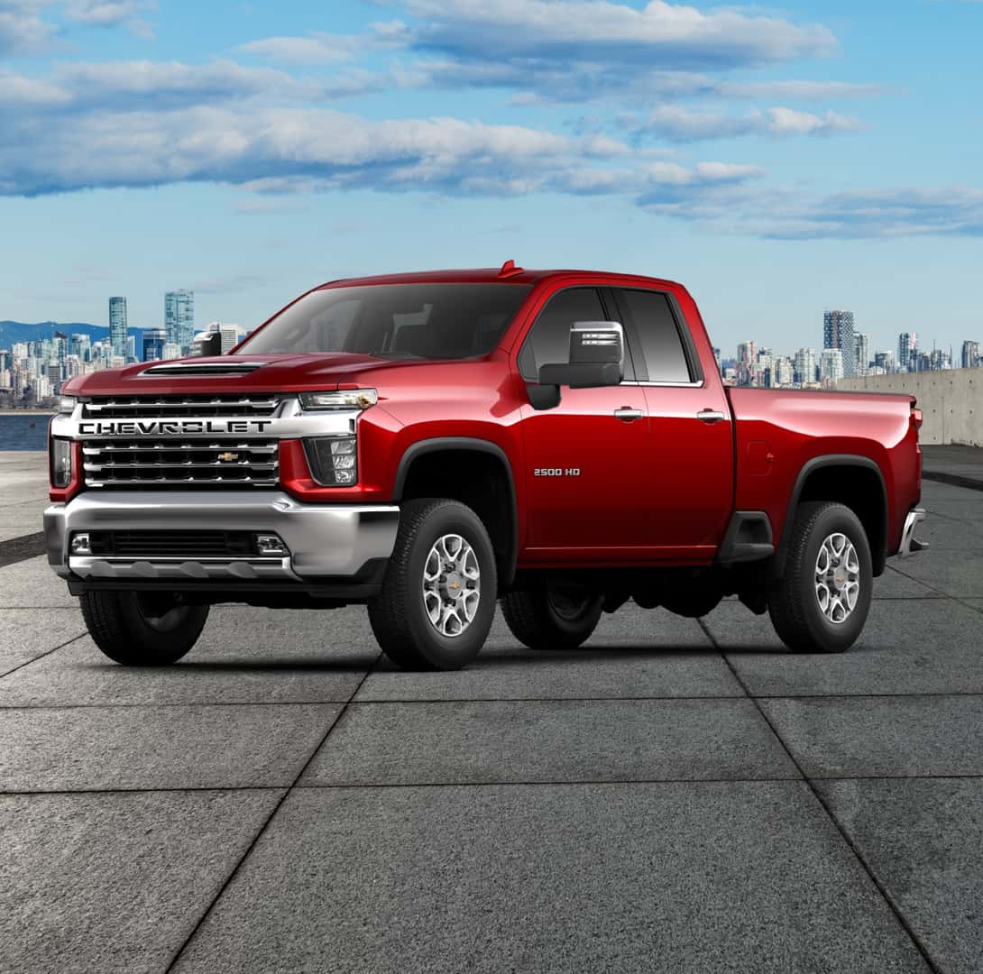 Red 2024 Chevy Silverado 2500 HD LT parked in a city