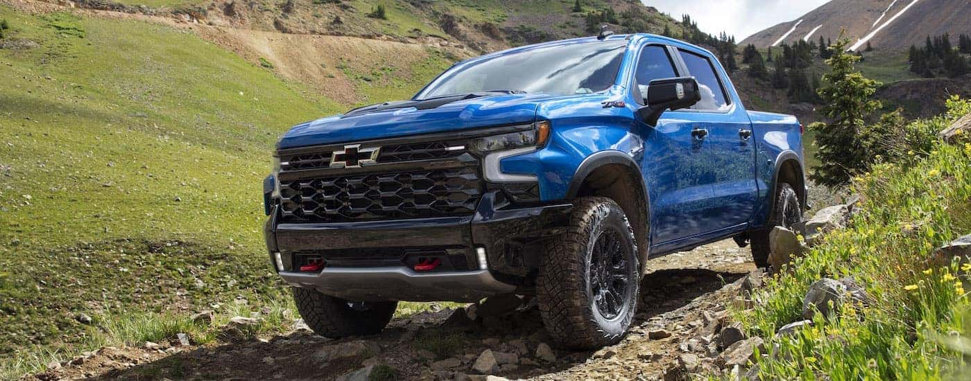 A blue 2024 Chevy Silverado 1500 ZR2 is shown from the front at an angle after leaving a Chevy dealer near Midlothian.