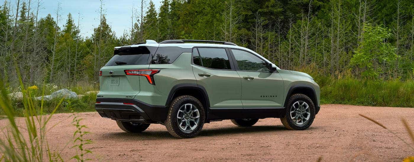 Rear view of a green 2025 Chevy Equinox.