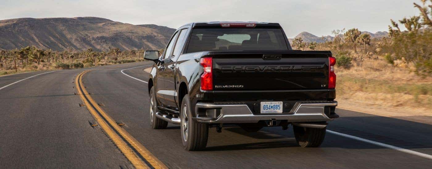 Rear angle view of a black 2022 Chevy Silverado 1500 LT.
