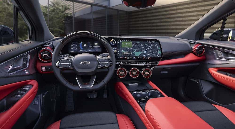 A red 2025 Chevy Blazer EV RS is shown from the driver's seat.