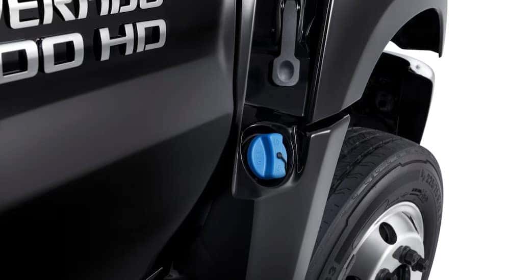 The diesel exhaust fluid port is shown on a black 2025 Chevy Silverado 4500 HD.