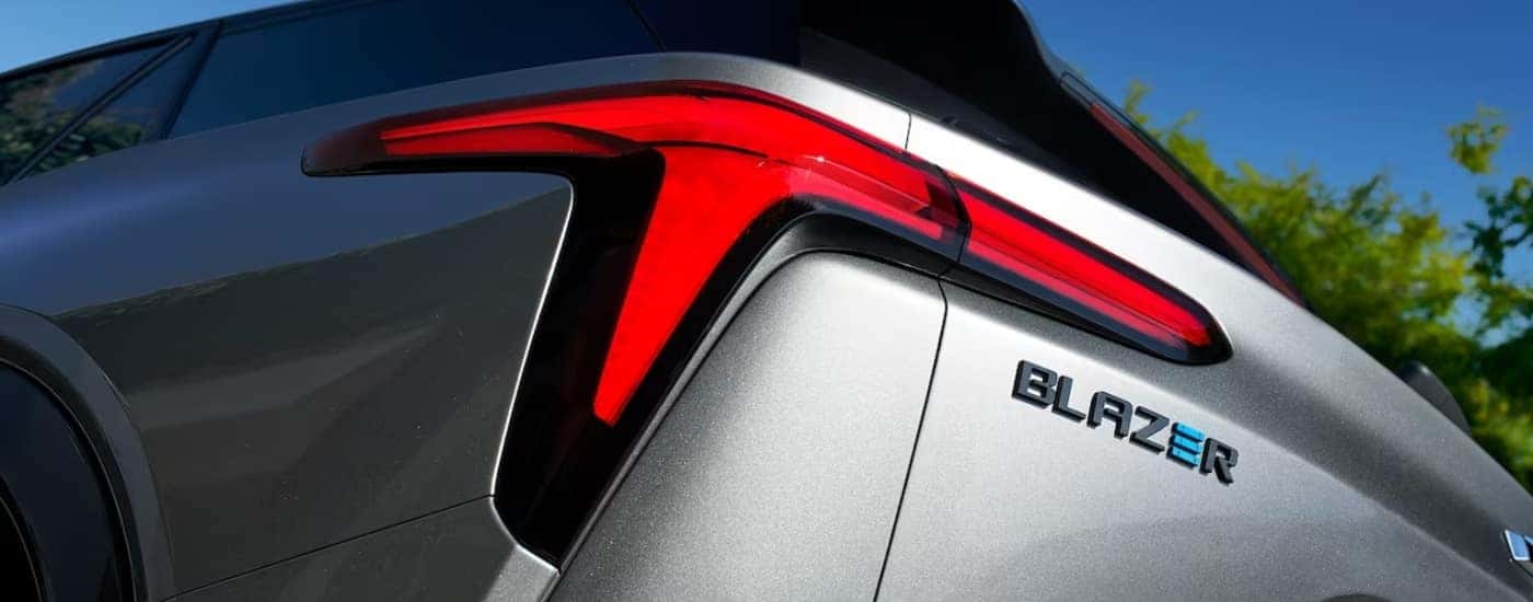 The driver side taillight on a silver 2024 Chevy Blazer EV for sale near Fredericksburg.