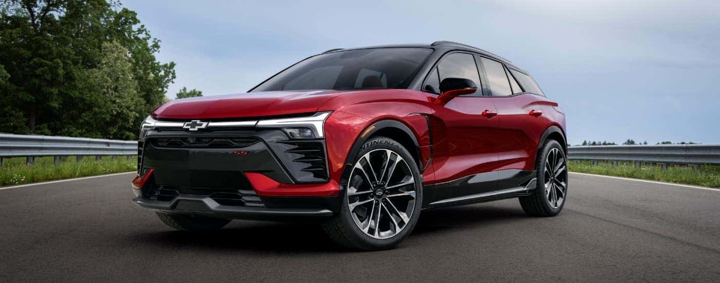 A red 2025 Chevy Blazer EV for sale near Midlothian is parked on a racetrack.