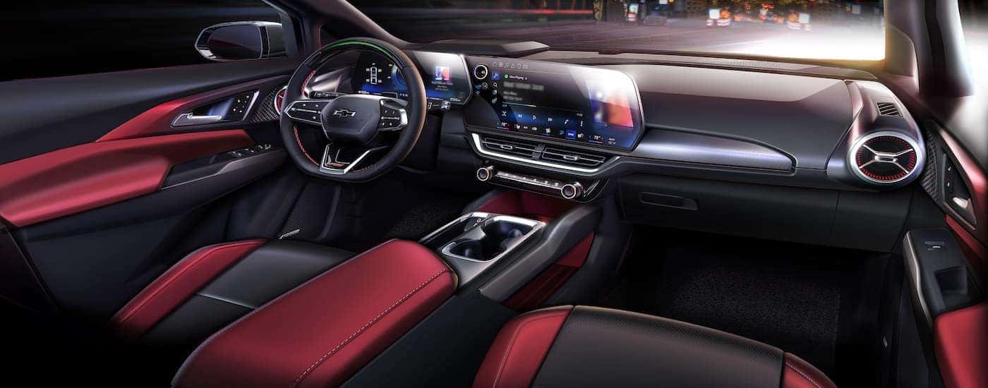 The red interior of a 2025 Chevy Equinox EV for sale in Richmond is shown.