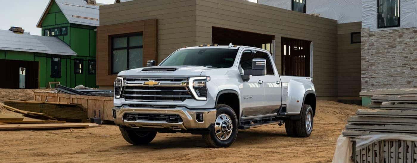 A white 2025 Chevy Silverado 3500 parked on a construction site