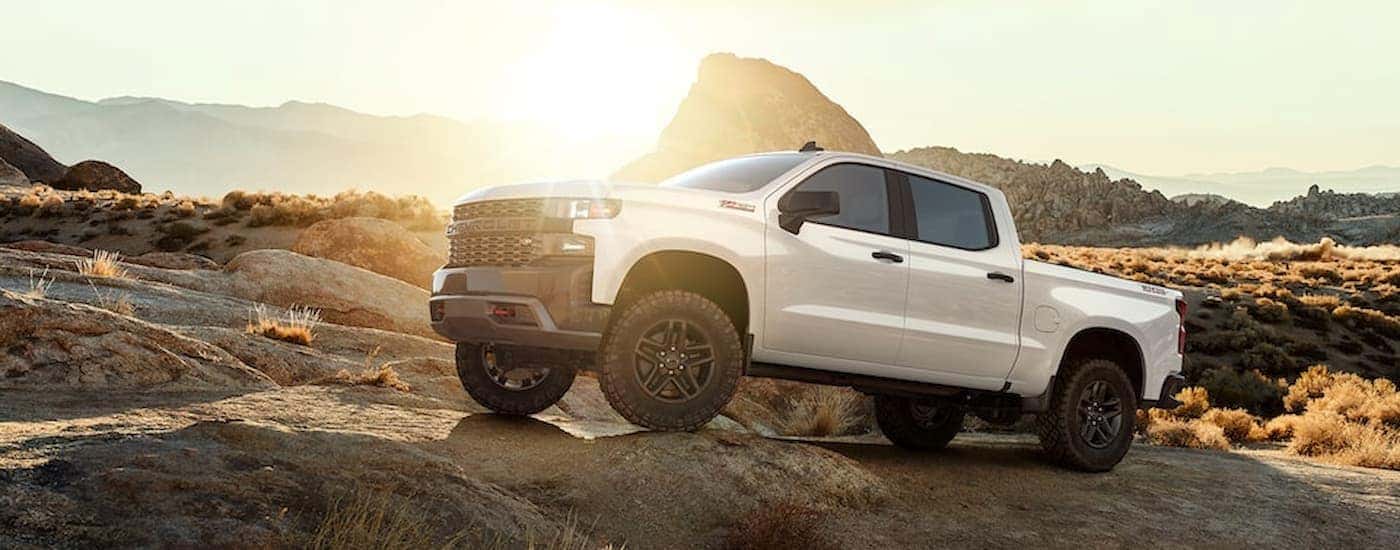 White 2022 Chevy Silverado 1500 Limited driving on a desert trail