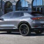 Silver 2025 Chevy Equinox EV RS parked on the side of a street